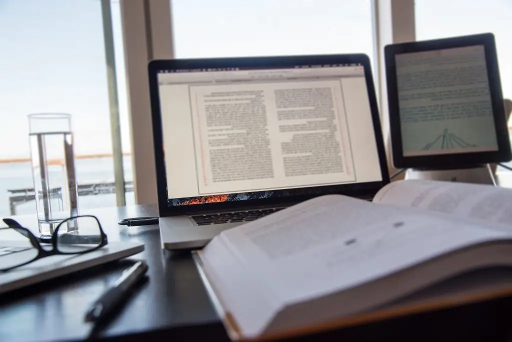 open-book-next-to-digital-devices-on-desk-2026-03-17-17-44-00-utc